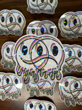 Load image into Gallery viewer, Large Clear Happy Sad Face Sticker. Melting Smiley Face Trippy sticker. Clear Holographic Laptop Sticker.