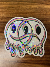 Load image into Gallery viewer, Large Clear Happy Sad Face Sticker. Melting Smiley Face Trippy sticker. Clear Holographic Laptop Sticker.