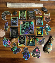 Load image into Gallery viewer, The Chariot Tarot Card Holographic Sticker. Dinosaur Alien Abduction Sticker. UFO Stickers. Dinosaurs. High quality Stickers.