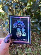 Load image into Gallery viewer, The Hanged Man Tarot Card Holographic Sticker. Mushroom Alien Sticker. Waterproof Stickers. High quality Trippy Stickers.