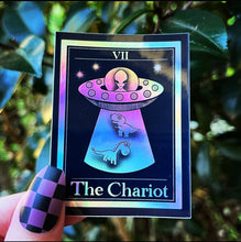 Load image into Gallery viewer, The Chariot Tarot Card Holographic Sticker. Dinosaur Alien Abduction Sticker. UFO Stickers. Dinosaurs. High quality Stickers.