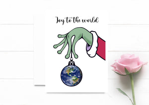 Joy To The World. Alien Hand Holding Earth Christmas Ornament. Holiday Card. Funny Xmas Card.