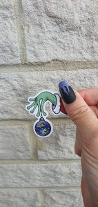 Christmas Ball Sticker. Alien Hand Holding Earth. Christmas Ornaments. Christmas Decorations. Trippy Xmas Sticker.