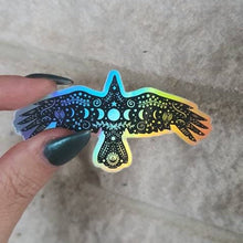 Load image into Gallery viewer, Crow Holographic Sticker. Sun And Moon Sticker. Witchy Sticker. Laptop Sticker. Flask Sticker. High quality Trippy Sticker